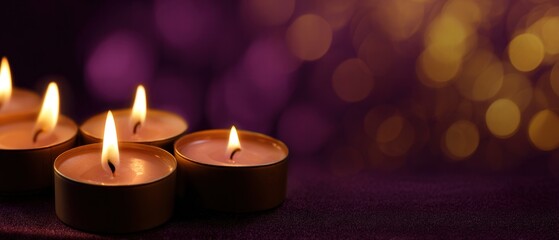Warm glowing candles with soft bokeh lights on a dark purple background creating a peaceful and spiritual mood for meditation and relaxation