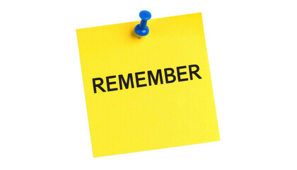 A yellow sticky note pinned with a blue pushpin displaying the word "REMEMBER" in bold black letters.