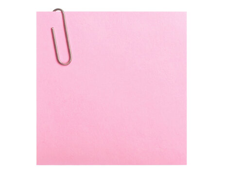 A square pink sticky note with a silver paperclip attached to its top left corner.