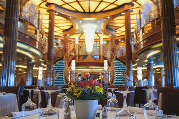 Formal and elegant ocean view dining room restaurant onboard luxury cruiseship or cruise ship liner...