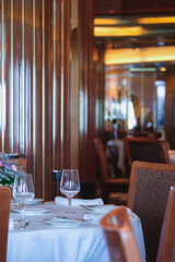 Formal and elegant ocean view dining room restaurant onboard luxury cruiseship or cruise ship liner...