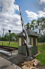Old railroad crossing gate and shack