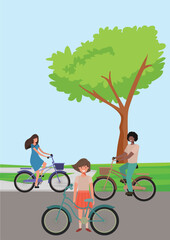 Naklejka premium Three Young girls riding bicycles in street