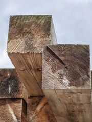 Square Wooden Planks Against a White Sky