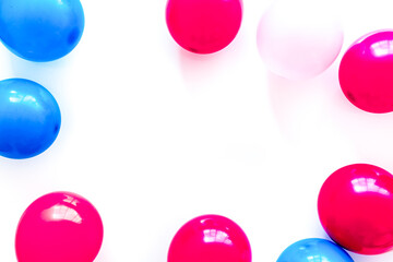 Colorful balloons frame on white background top-down frame copy space