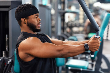 Side view of black guy bodybuilder making work out for shoulders and chest muscles at gym, copy...