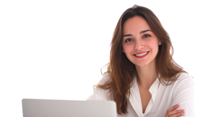 A woman is sitting at a desk with a laptop in front of her