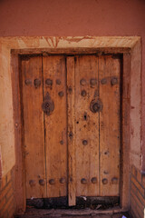Persian ancient dorway with door knockers at Abyaneh Village, Iran.
