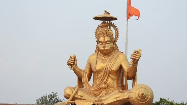 Majestic Pitreshwar Hanumanji metal statue at PitraParvat, Indore, captured during a stunning sunset, radiating spiritual serenity and cultural grandeur.