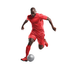 A man in a red shirt and red shorts is kicking a soccer ball