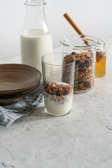 Kefir, homemade granola, and honey, healthy breakfast ingredients