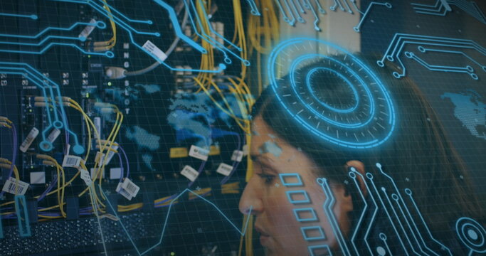 Examining female IT tech inspecting network rack in server room, with ethernet cables, copy space