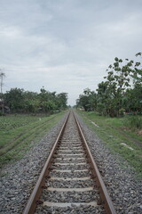 Endless Journey A Tranquil View of a Railway Track Stretching into the Horizon