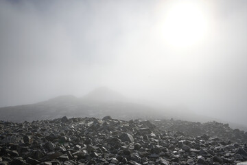 Dense mist at the summit of Scafell Pike in winter, Lake District, UK