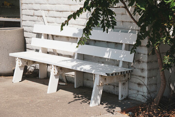 Old wood outdoor bench and wall
