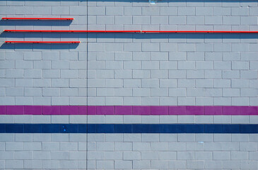 Outdoor building wall with painted stripes