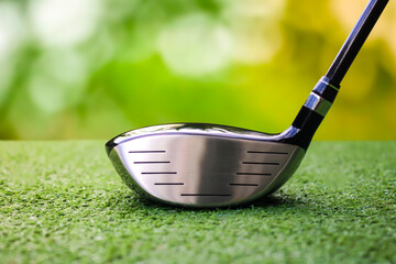 Close-Up of Golf Club Driver Head on Lush Green Grass Background