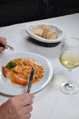 Dining on a Delicious Seafood Dish with Rich Sauce and Bread