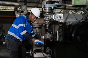 Industry factory, machine. Engineer worker, maintain, repair mechanism of operation of drilling milling machine in factory