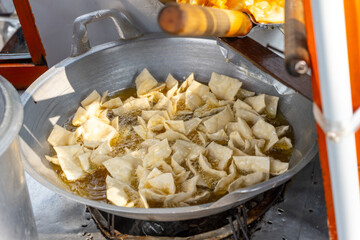 Frying Crispy Batagor in Oil in a Frying Pan. Street Food