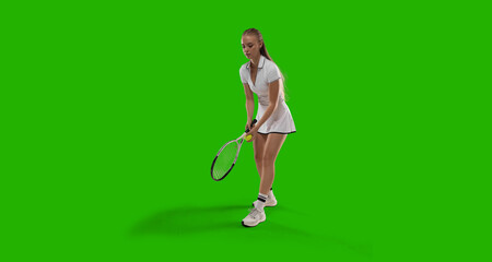 Woman tennis player playing tennis on green screen background.