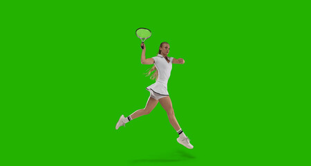Woman tennis player playing tennis on green screen background.