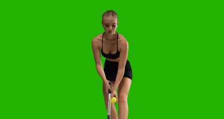 Woman tennis player playing tennis on green screen background.