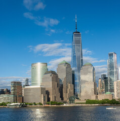 Tall office buidlings and One World Trade Center along the waterfront in Lower Manhattan as seen from Hudson River