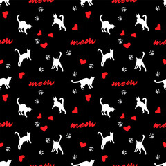 White silhouettes of cats on a dark black background with red hearts and paw prints. Seamless pattern, print, vector illustration