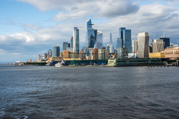 Tall office and apartment buidlings along the waterfront in Manhattan from Pier 57 towards Hudson Yards