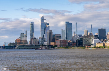 Tall office and apartment buidlings along the waterfront in Manhattan from Pier 57 towards Hudson Yards