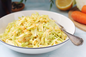 A bowl with coleslow salad