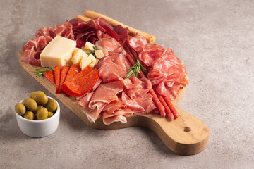 Charcuterie board. Antipasti appetizers of meat platter with salami, prosciutto crudo or jamon and...
