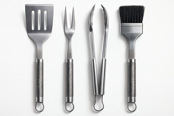A collection of stainless steel grilling tools, including a spatula, fork, tongs, and basting brush, arranged on a white background.