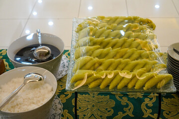 Serving Traditional Indonesian Sweets and Toppings Ready for Event Catering