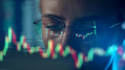 Trader wearing glasses is working on laptop computer. Screen with stock market charts and Bitcoin BTC or Ethereum ETH data analysis reflection. Broker trading online. Altcoins crypto currency trading - Powered by Adobe