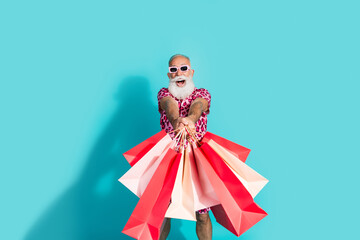 Photo of cool retired bearded male excited shopper wear trendy pink leopard print outfit isolated on aquamarine color background