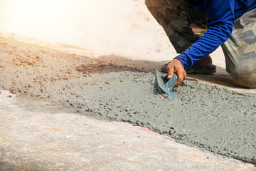 Workers are plastering at the construction site.