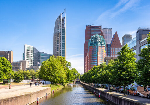 The Hague, Netherlands - May 14, 2025: Cityscape of the skyscrapers near the Central station, with the Hoftoren, the Castalia, the Zurichtoren and the Turfmarkt building, which house ministries.