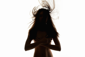 female silhouette. Nude body woman with flying Hair. Isolated naked girl