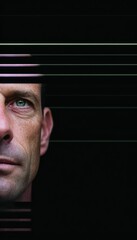 Close-up portrait of a man, face partially obscured by lines