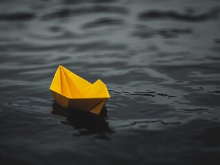 Minimalist Depiction of Hope: A Small Yellow Paper Boat on Dark Water