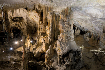 view of rock formation inside cave in postonja slovenia (stalagmite and stalactite formations...