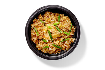 Delicious fried rice with chicken and sesame seeds in a black bowl