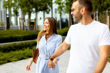Joyful stroll through a vibrant urban park on a sunny afternoon with friends enjoying each other’s company