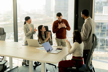 Collaboration among diverse professionals in modern office space during a strategic meeting