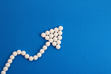 Arrow going up, aspirins to improve blood circulation