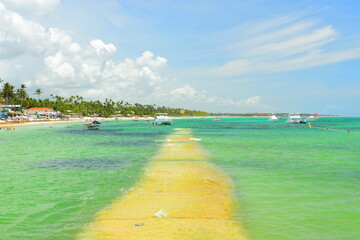 El Cortecito, Punta Cana, Dominican Republic- June 12, 2025: People walking along the coastline and...