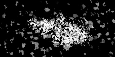 Snowflakes on dark background. white icy snowflakes isolated on black background, natural background. white crystalline powder on a black background. sugar dust. texture, pattern and clipping.