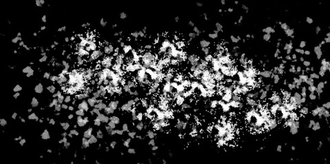 Snowflakes on dark background. white icy snowflakes isolated on black background, natural background. white crystalline powder on a black background. sugar dust. texture, pattern and clipping.
